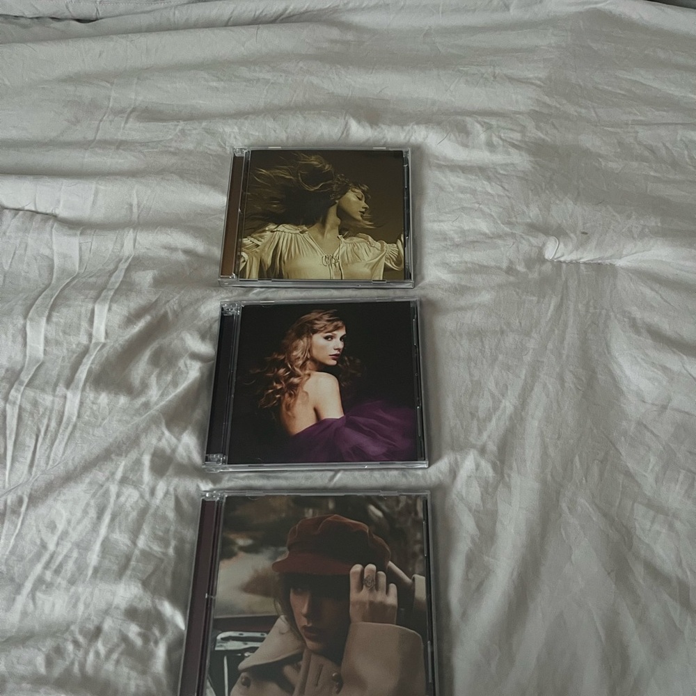 Set of Three Music CDs with Artistic Covers